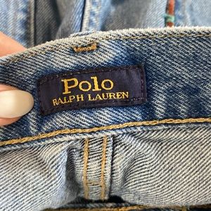 These jeans are straight leg jeans with patches, rips, and intricate designs